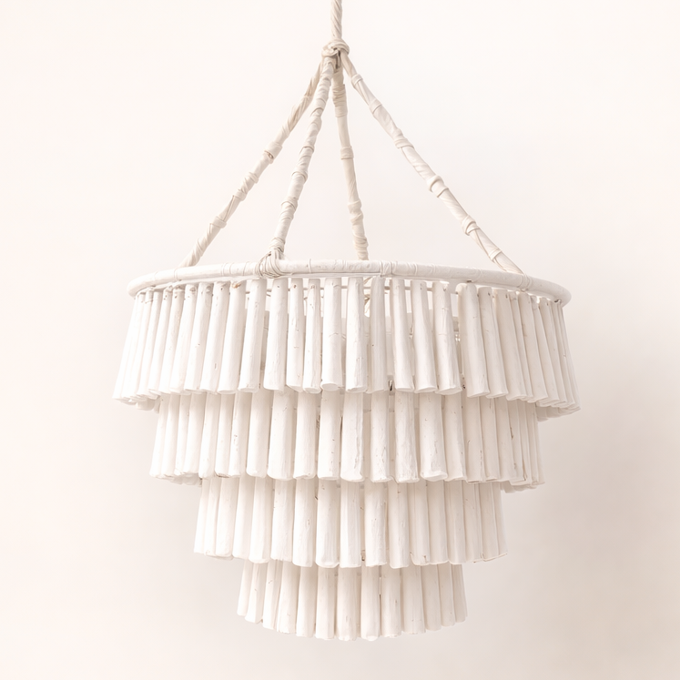 White tiered pendant light against a white background