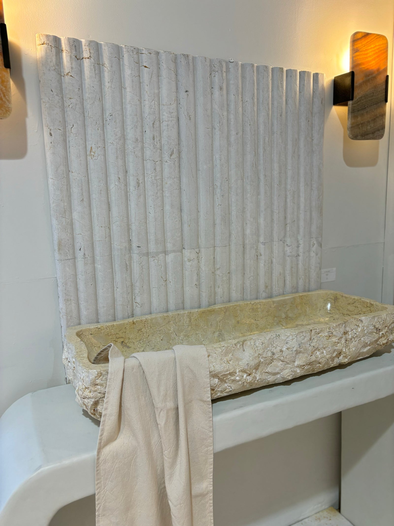 Yollam : long marble basin with rough finish