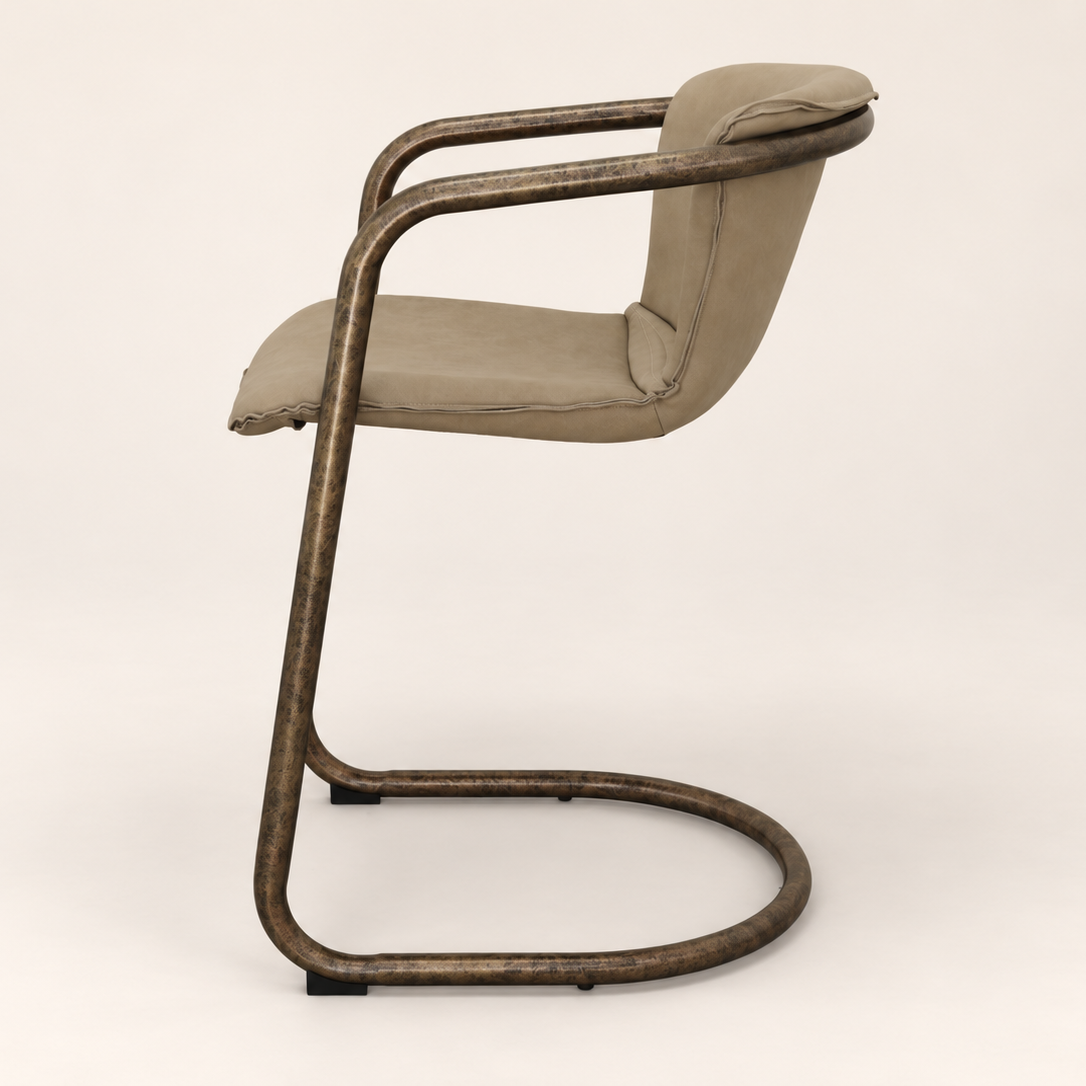 A modern cantilever barstool with a curved dark bronze metal frame and light beige upholstered seat and backrest, shown from a side profile view against a neutral off-white background.