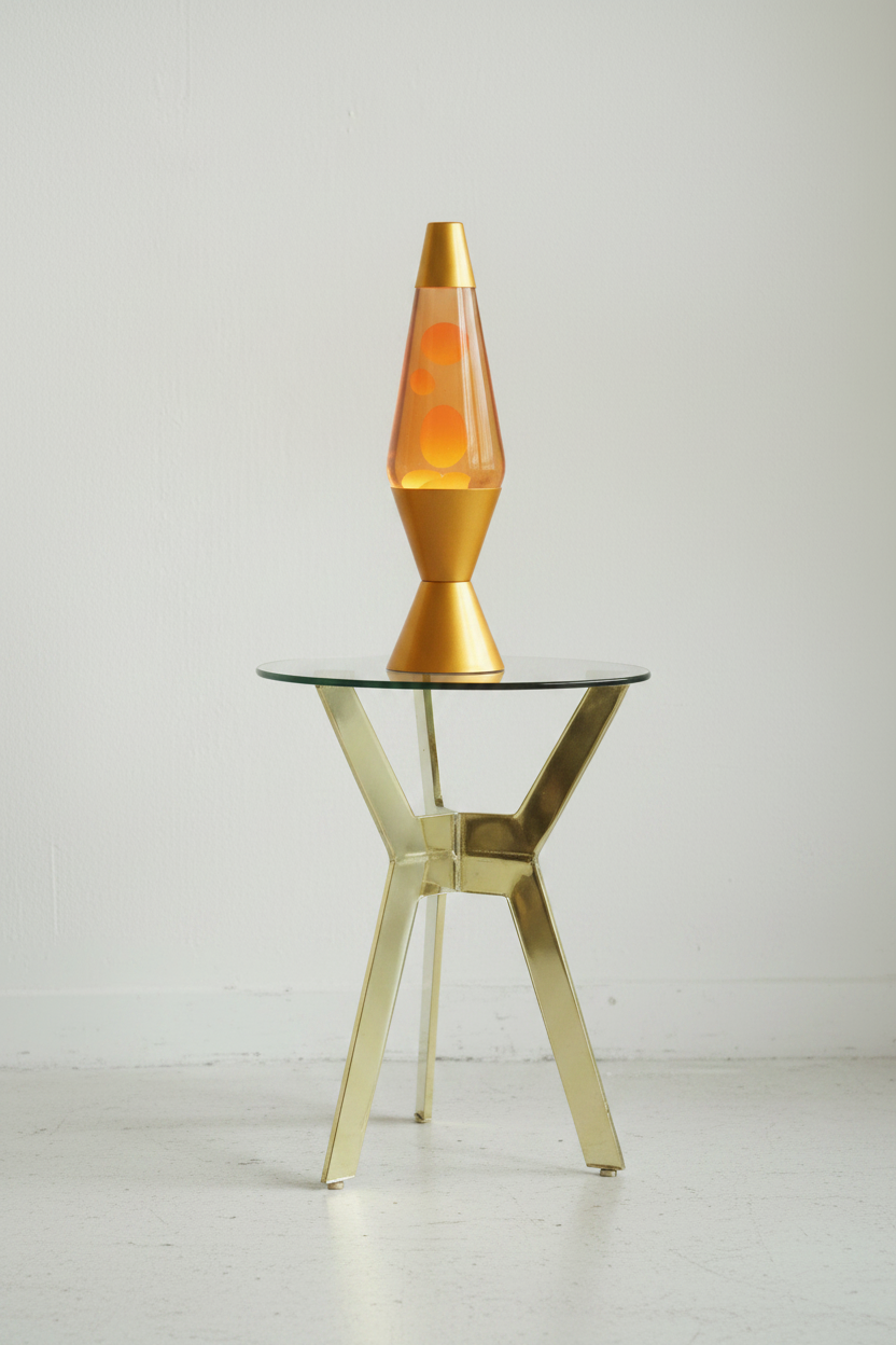 Ruhi : Metal Side Table, with Brass Finish featuring a Smokey Glass Top.