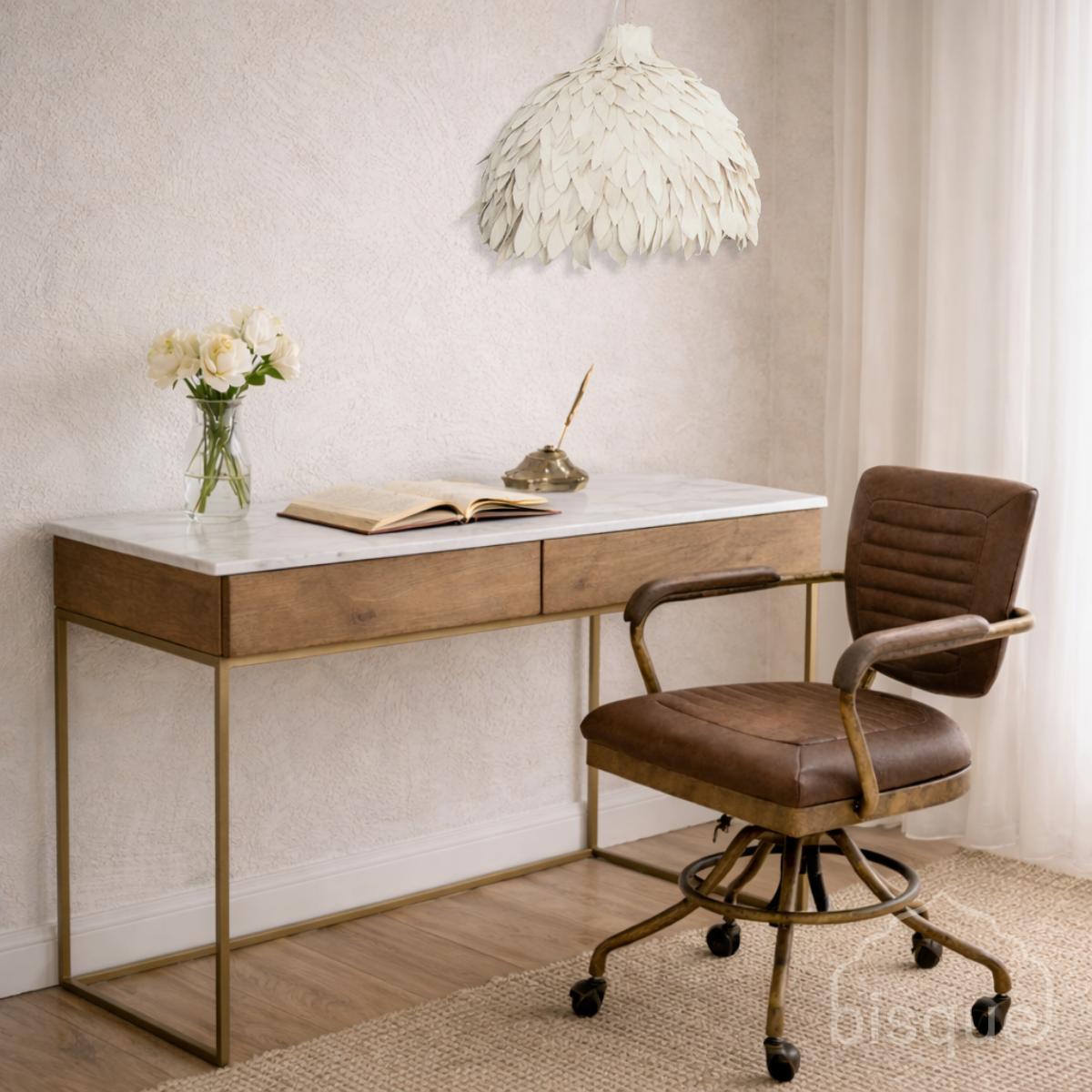 Adjua cotton leaf pendant ligh over a Modern desk with marble top and wooden frame, accompanied by a brown office chair.