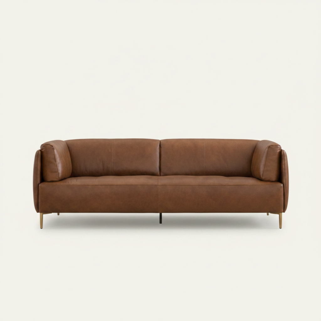 Brown leather sofa with a wooden coffee table in a living room setting.