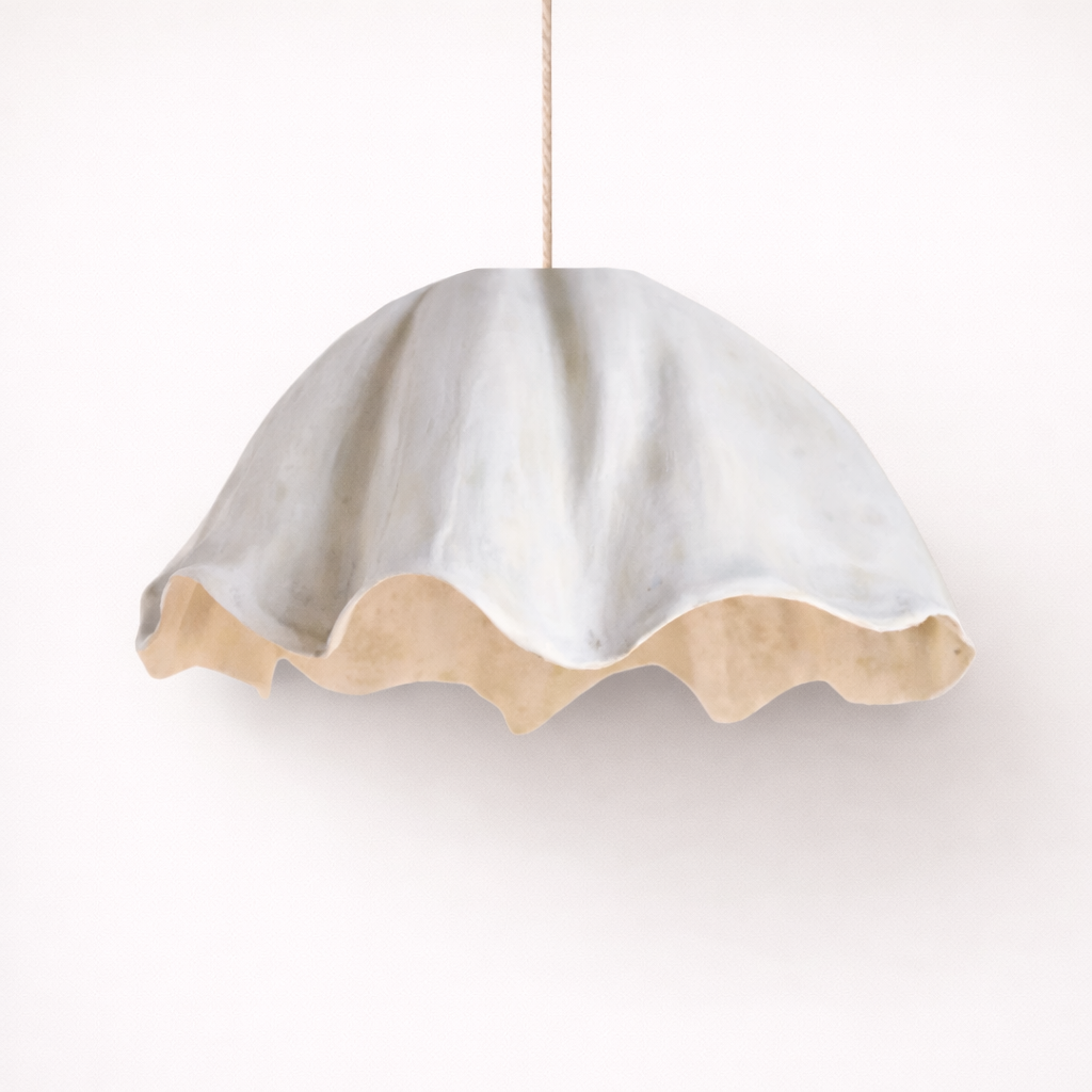 White scalloped-edge pendant light on a white background