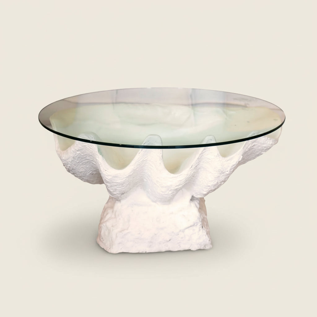 A white clam resin coffee table with a glass top 80cm diam