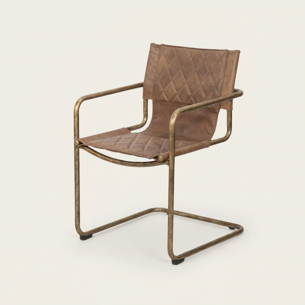 carmella 1970's glamour style tan leather chair with a bronze metal base