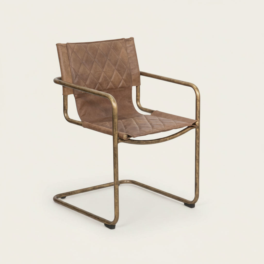 carmella 1970's glamour style tan leather chair with a bronze metal base