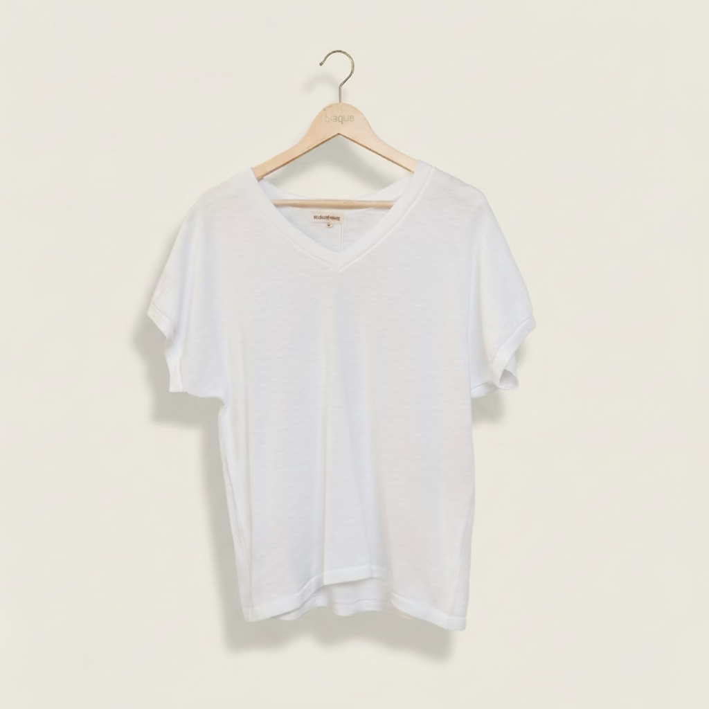 White 100% cotton v-neck t-shirt on a hanger against a plain background