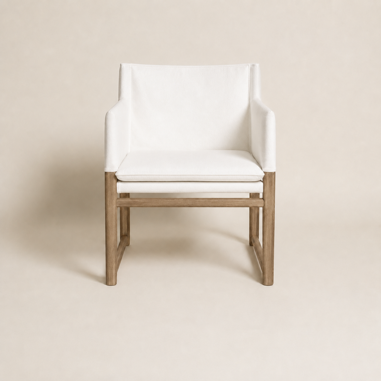 A modern accent kovo outdoor sunbrella and teak chair with white upholstered seat and backrest, supported by a light natural wood frame, shown against a solid beige background.