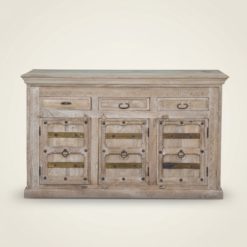 Ragesh whitewashed 3 door indian carved cabinet with brass detailing. Bisque