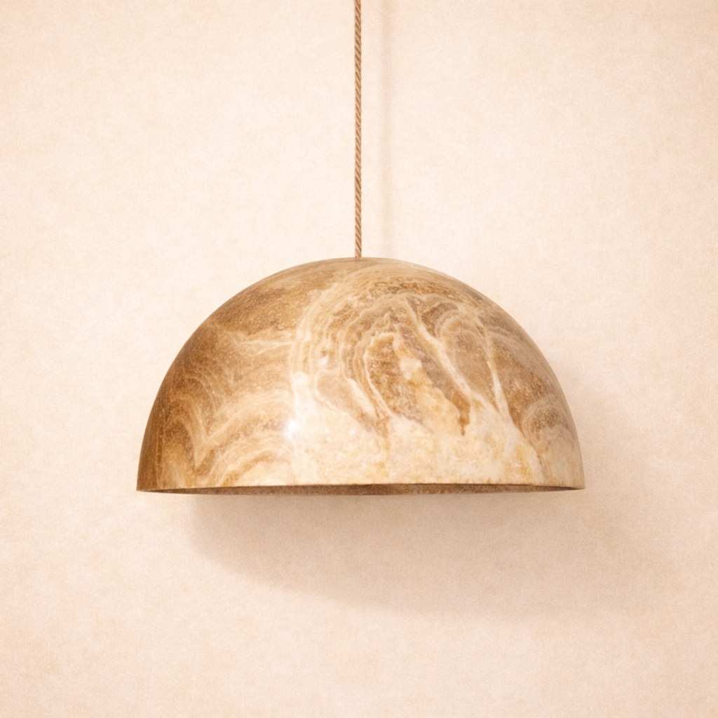 Onyxt dome 30cm pendant light hanging against a beige wall