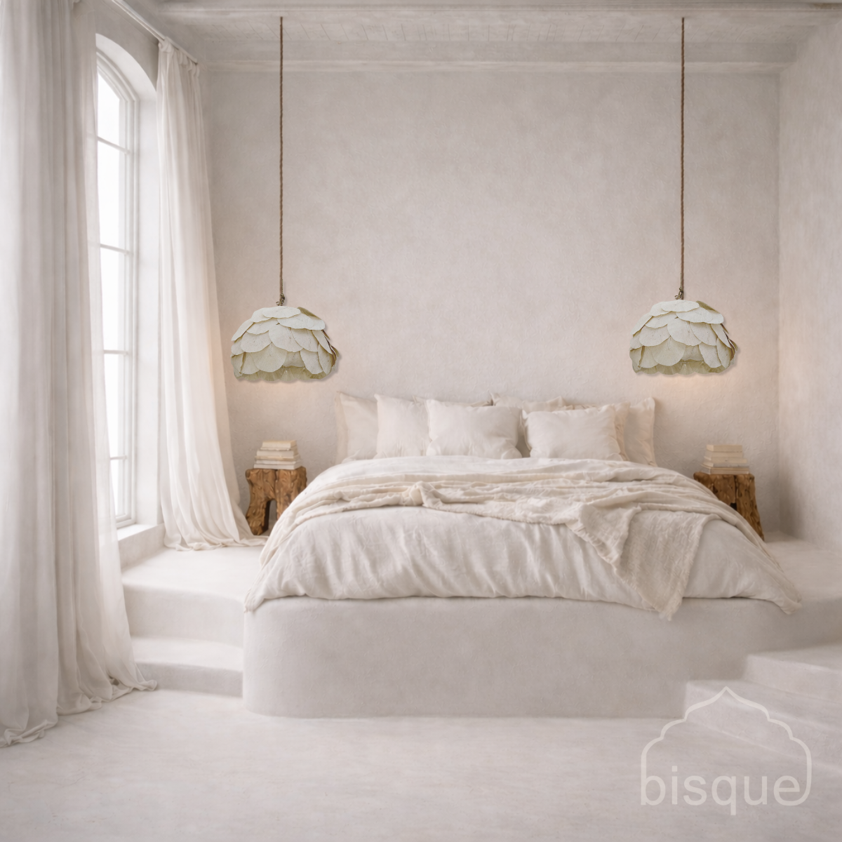 Sofia petal pendants hanging beside the bed in a bedroom with light decor.