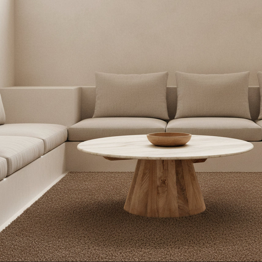 Round marble top coffee table with a tapered wooden base made from mango wood.