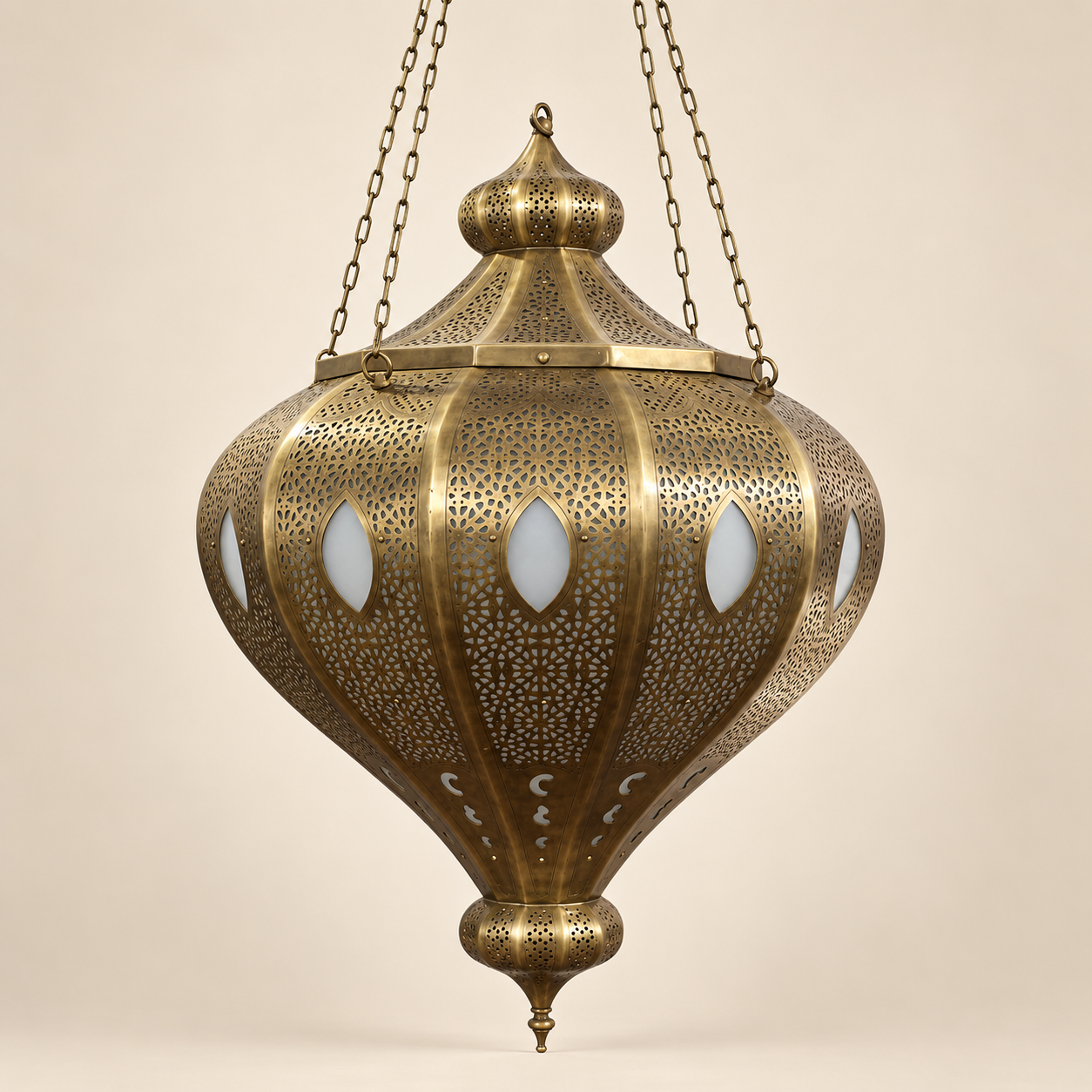 An ornate hanging brass lantern with intricate laser-cut geometric patterns and oval cutouts, suspended by chains 