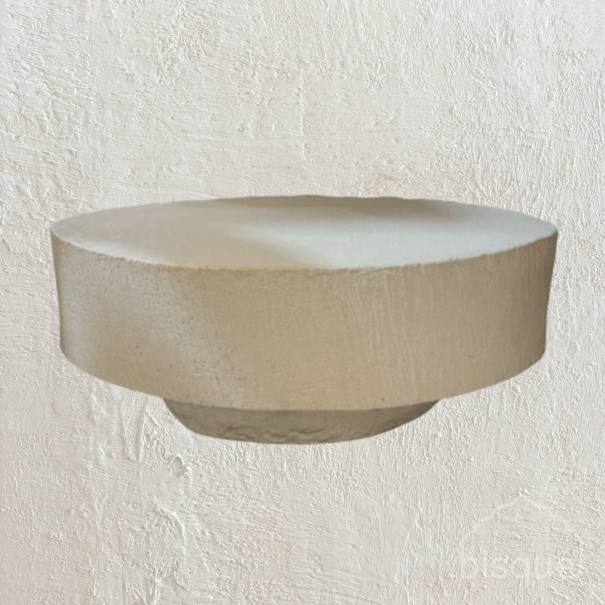 &#39;Elena&#39; GRC oval coffee table with rough stone appearance on the sides.