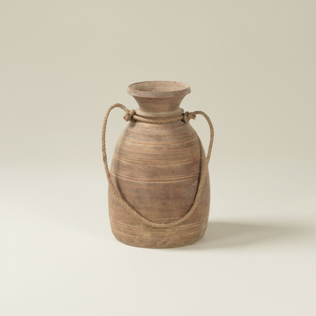 Wooden vase with handles on a textured white background