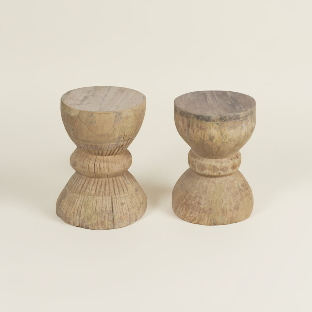 two hand carved wooden stools 