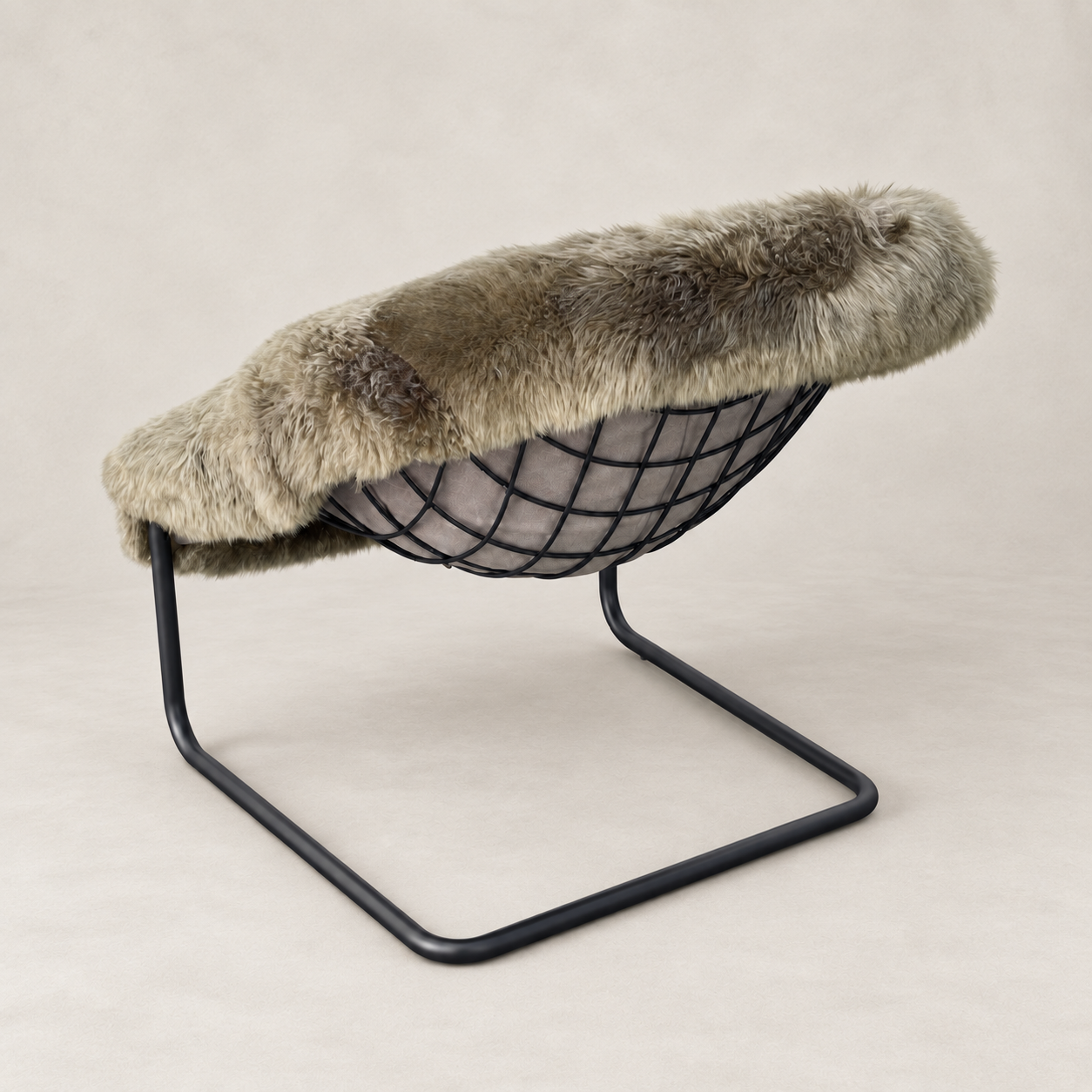 A modern lounge chair with a black wire bowl seat, supported by a black metal U-shaped frame, and topped with a thick, plush taupe-gray faux fur throw.