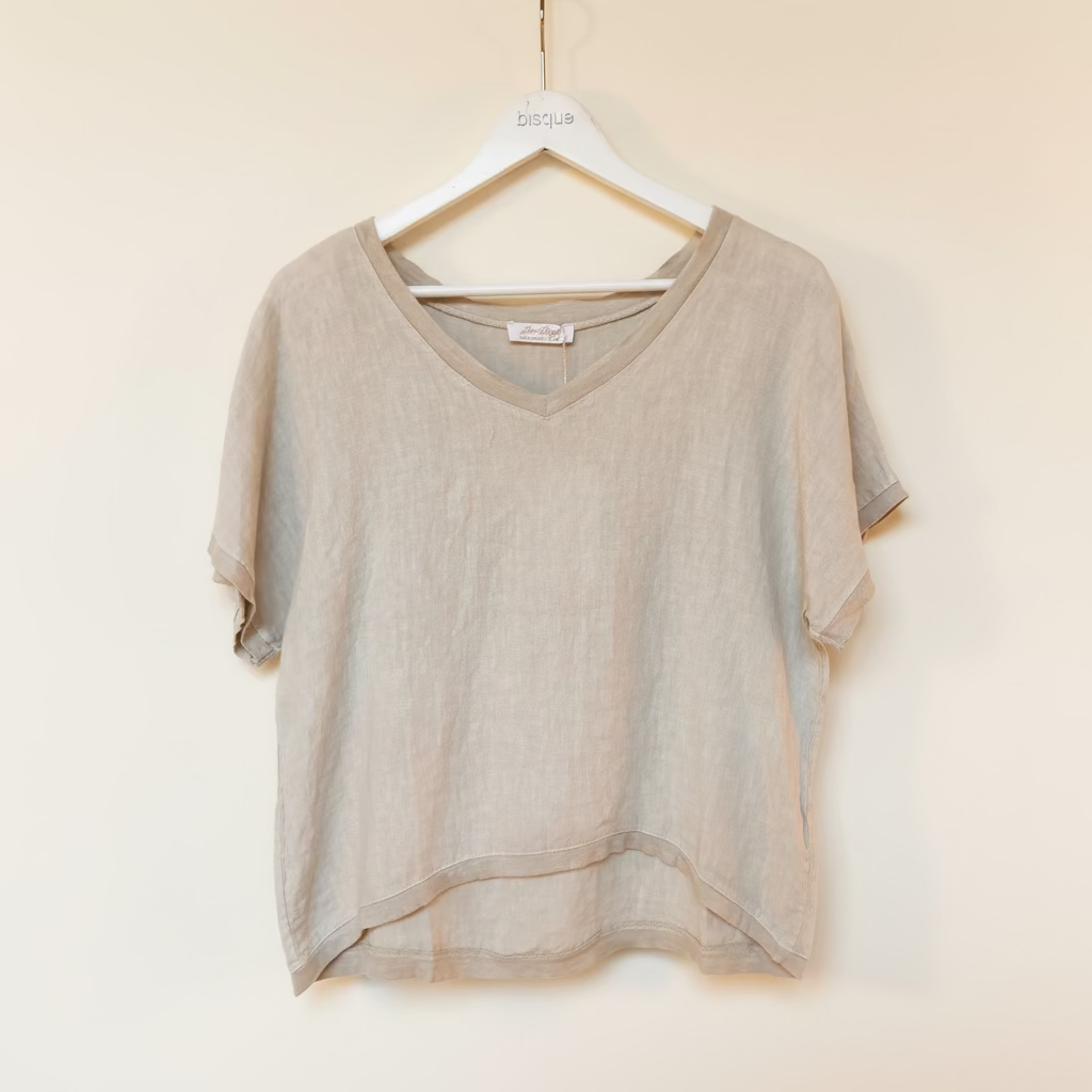 Sand Italian linen t-shirt on a hanger against a plain background