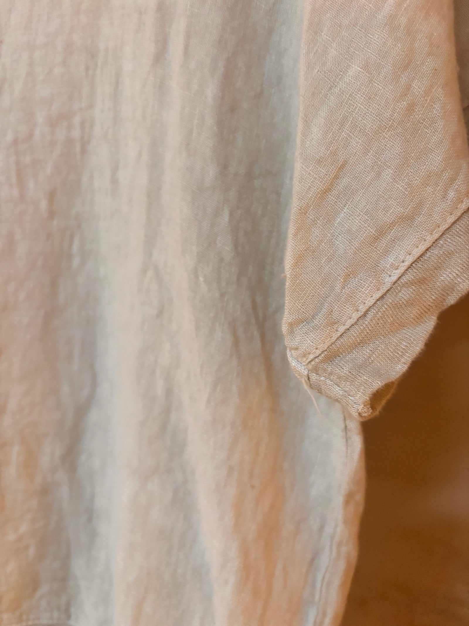 Close-up of beige linen fabric with a soft texture