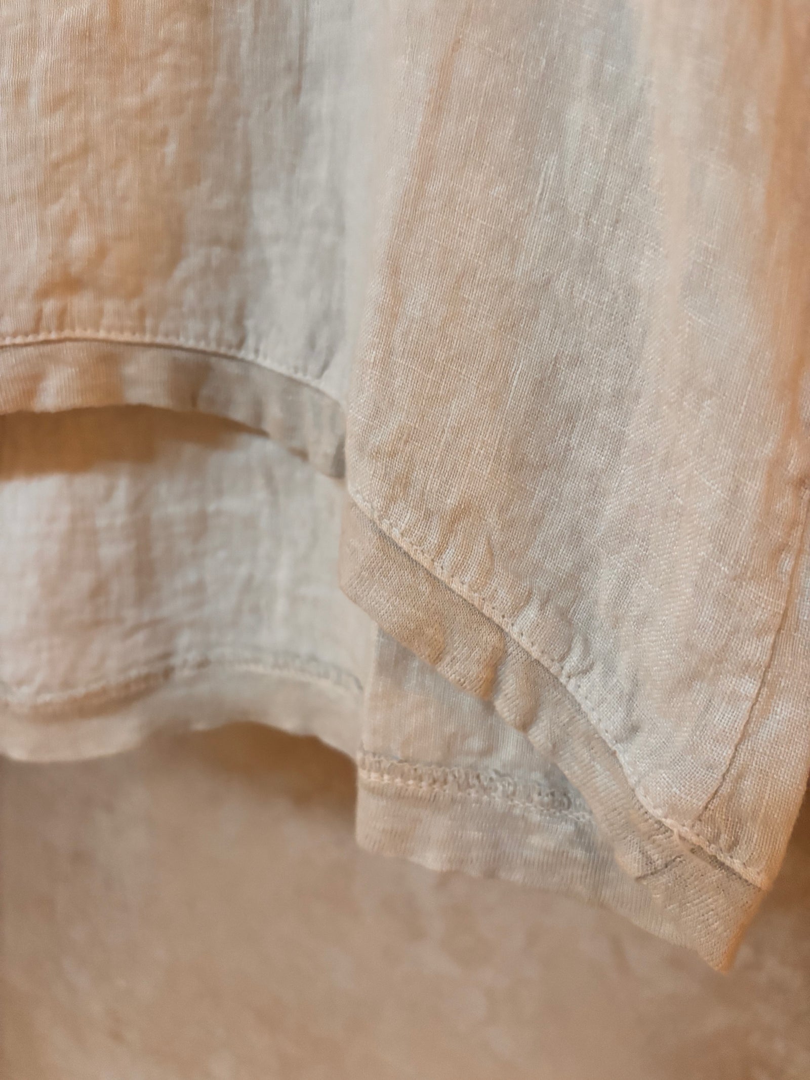 Close-up of beige linen fabric with a soft texture