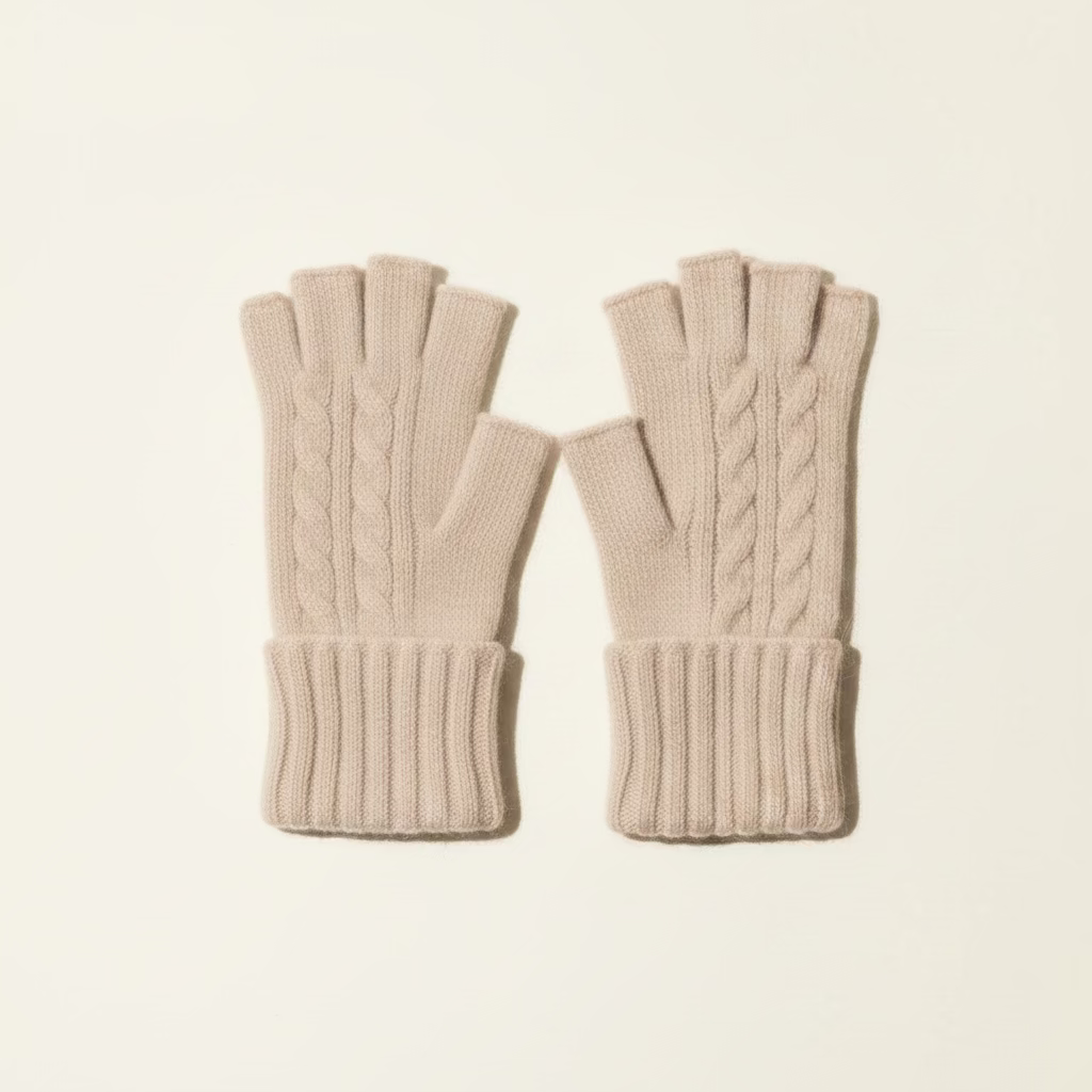 Pair of fingerless gloves in brown and gray on a wooden surface