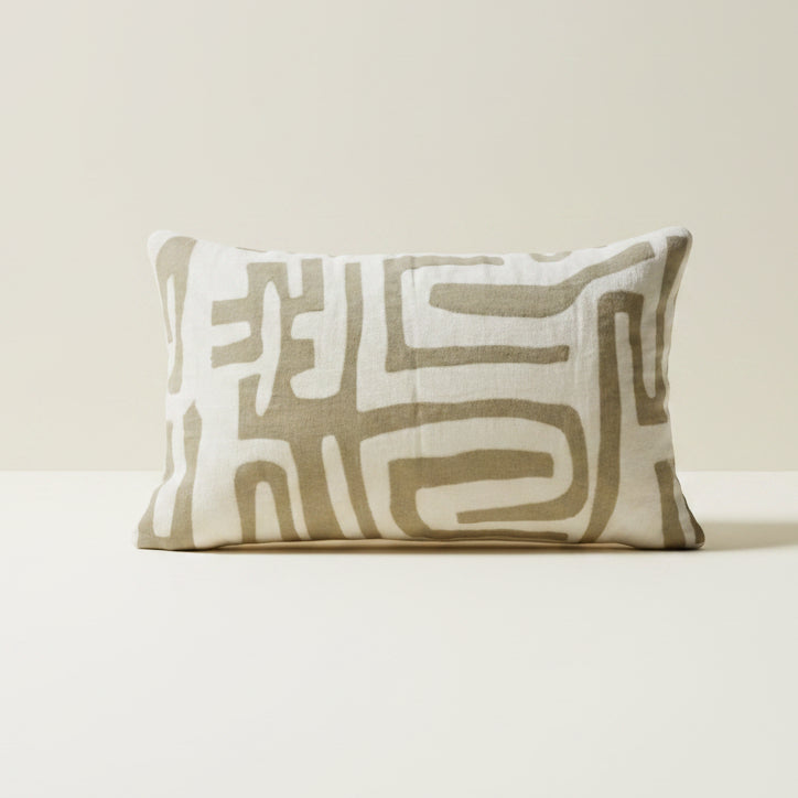 Decorative pillow with geometric pattern on a white background