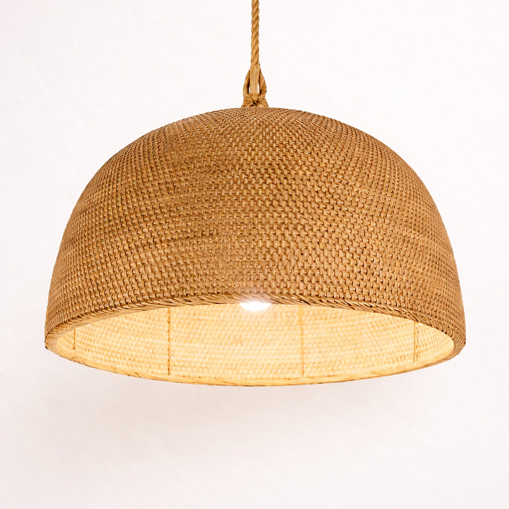 Woven Josefa rattan dome pendant light on a white background
