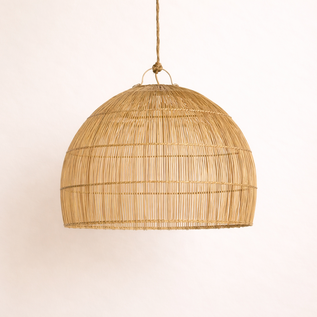 Woven Misozi rattan pendant light on a plain background