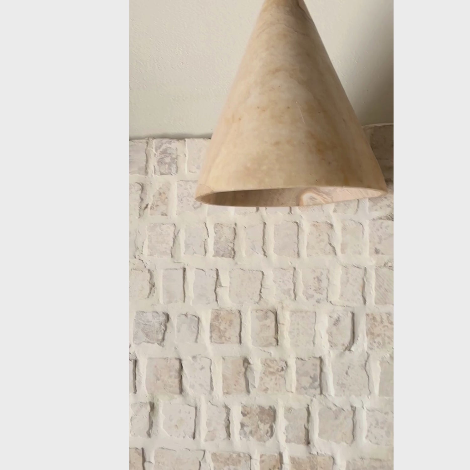 Santan : Polished Onyx cone pendant.