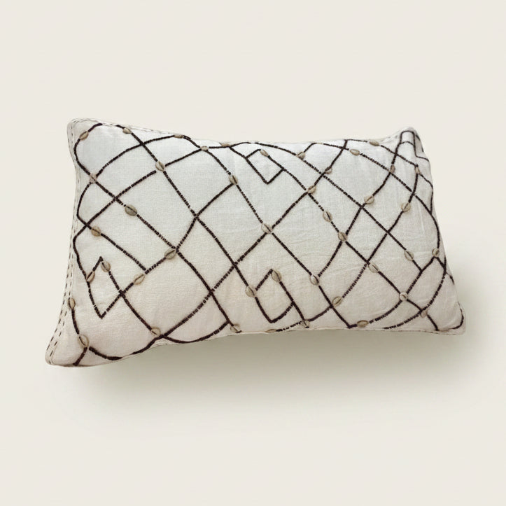 Decorative pillow with geometric pattern on a white background
