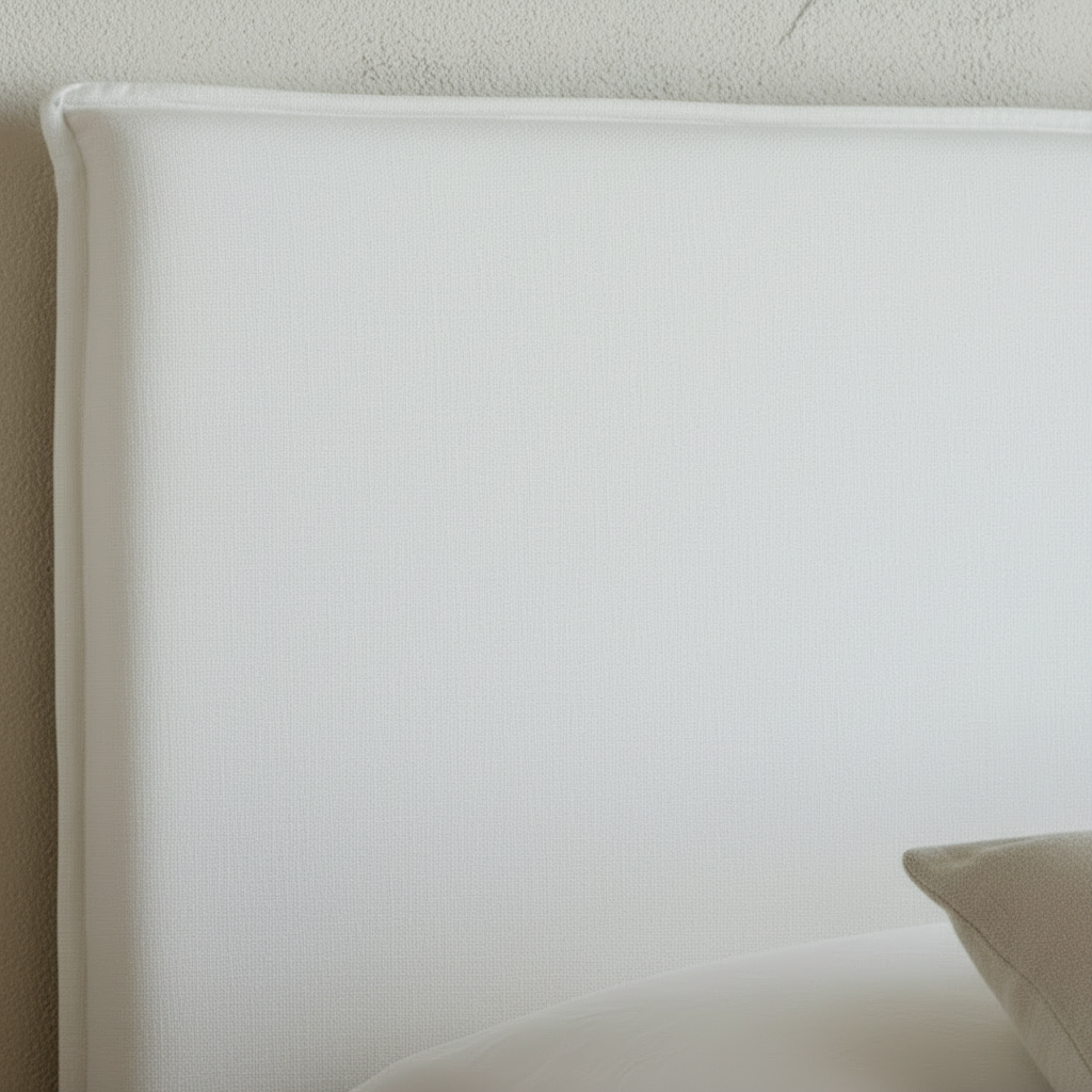 Bedroom with a bed, side tables, and hanging lamps in a neutral color scheme.