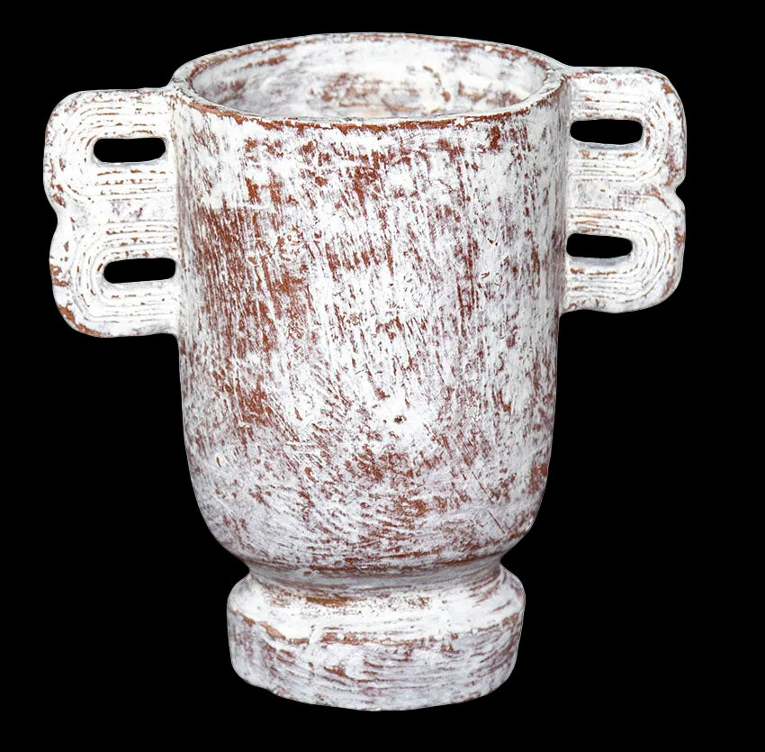 A white terracotta vase with a wide mouth and wing-like additions on the sides, standing on a flat surface.