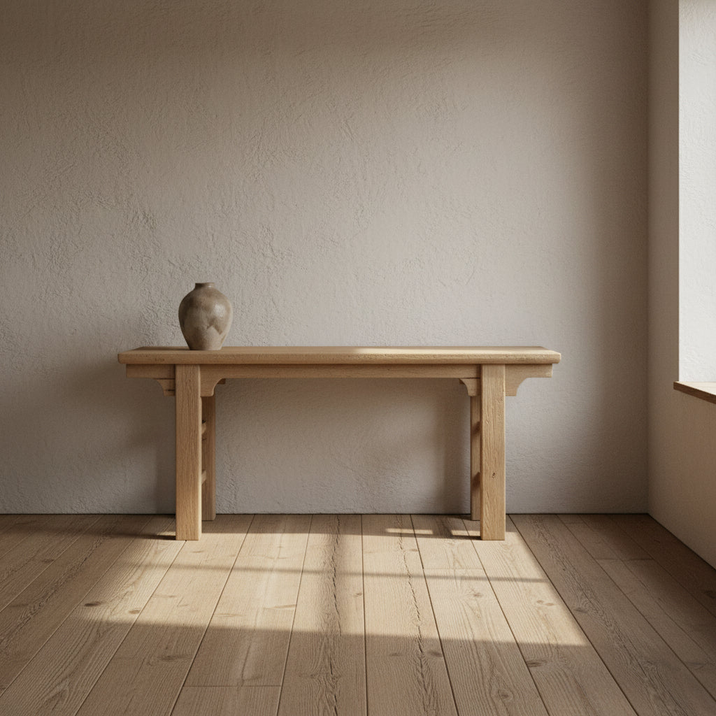 Ableached finish Oriental console table made of old pine, with a rectangular tabletop and wooden legs.